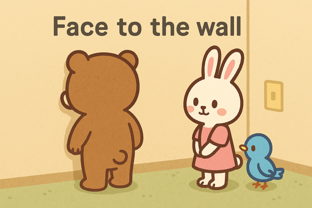 壁に向かって立っているぜすと君